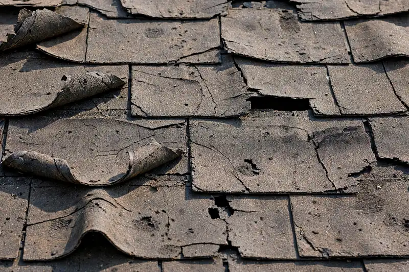 Damaged roof shingles before repair — Prism Roofing Dearborn MI